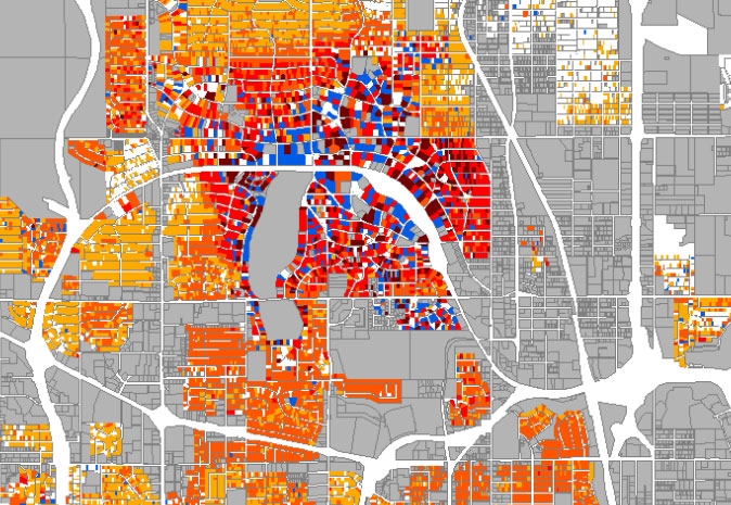Parcel-level map of local square-footage marginal effects. Adjacent parcels range from blue negative effects through white neutral effects to yellow, orange, and red positive effects.